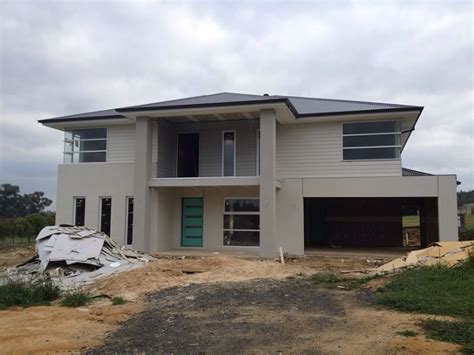 Surfmist Cladding And Render With Shale Grey Columns Exterior House