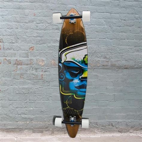 A Skateboard With Graffiti On It Hanging From A Pole In Front Of A