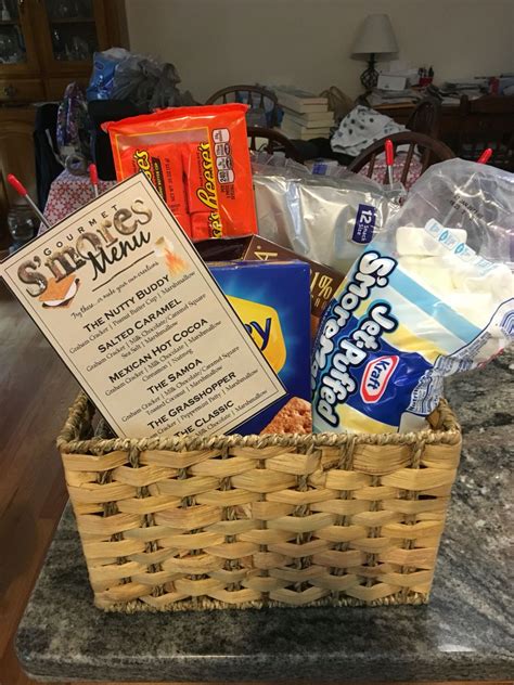 Whether they are just getting started out in their career as a swimmer, or on their way to the olympics, this gift guide for swimmers has it all. Gourmet S'mores Gift Basket #rafflebasket # ...