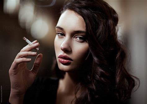 Beautiful Woman Posing With A Cigarette By Stocksy Contributor Mosuno Stocksy