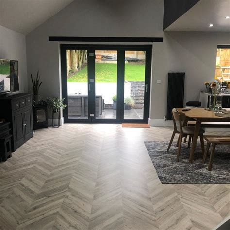 Unlike wood or laminate flooring, luxury vinyl tiles can be. Signature Herringbone - Light Oak Parquet Laminate ...