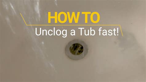 Unclog your bathtub drain with baking soda and vinegar. Unclog a Slow Draining Tub Fast - YouTube