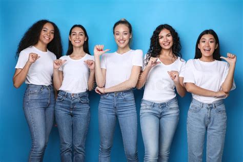 Diverse Girls Pointing At Themselves Smiling Posing In Studio Stock
