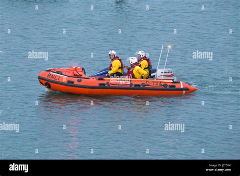 Crew On Board The Inshore Rnli Life Boat Returning To Sure After