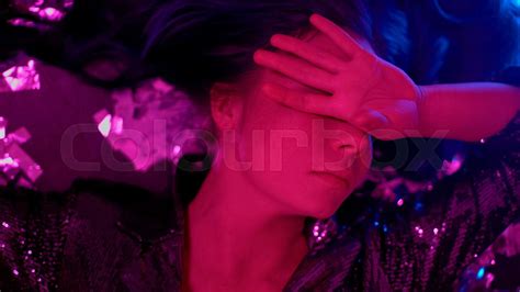 drunk girl awakening on floor after party feeling dizzy and sick top view stock image