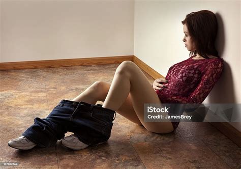 Beautiful Woman Alone With Her Thoughts Pants Down Around Ankles Stock