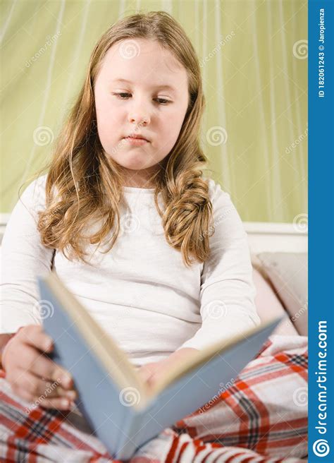 beautiful blond girl sick in bed reading a book stock image image of people epidemic 182061243