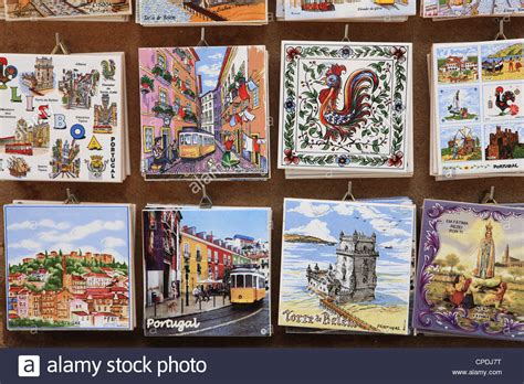 A gift shop is a shop that sells goods that are suitable for giving as presents. Souvenir tiles in shop display, Lisbon, Portugal, Europe ...