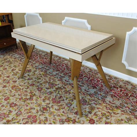 Versatile design allowing configuration of three table styles. Castro Convertible Coffee-to-Dining Table | Chairish