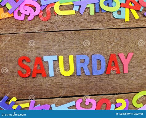 Colorful Wooden Alphabet Saturday Spelling On Wooden Background Stock
