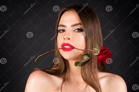 Seductive Sensual Woman Holding Red Rose With Teeth Close Up Portrait