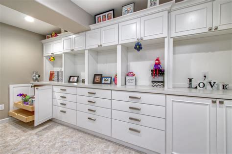 Craft room with movable work tables, hidden washer 8 photos. Showplace Cabinets in white satin span an entire wall ...