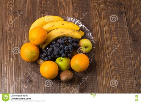 In Dish Are Heathful Bananas Oranges Grapes And Apples Stock Image