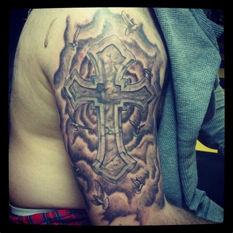 You don't have to go all the way up your arm to wow a crowd. Cross/clouds half sleeve by tatbalmer on DeviantArt