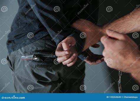 Man Putting Handcuffs On Drug Dealer Closeup Stock Photo Image Of Drug Addiction