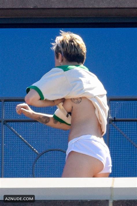 Miley Cyrus Topless Wearing Only White Shorts On The Hotel Balcony In