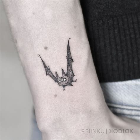 A Small Bat Tattoo On The Wrist