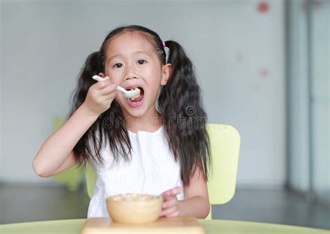 Child Girl Eating Healthy Food With Deliciousness At Home Stock Photo