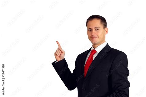 Handsome Young Man In A Suit Pointing Up To His Right Side Stock Photo