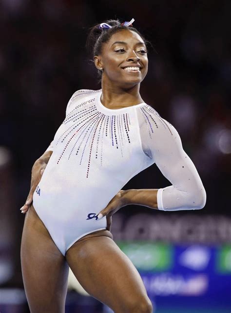 Simone Biles Shows off Her Toned Figure in Cool Snake Print Top and ...