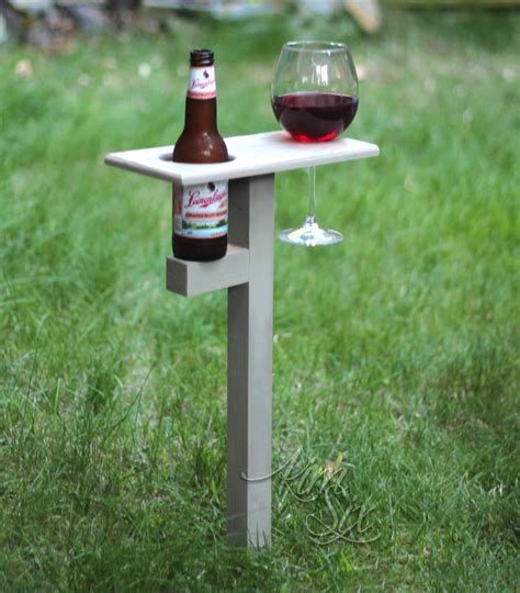 The handle creates a point of symmetry and makes it easier to carry everywhere you go. in-ground-beverage-caddy.jpg