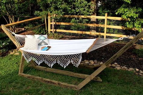 Build a backyard hammock stand from scratch. How to Make a Free-Standing Hammock Stand | Hunker