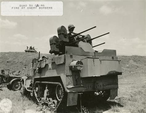 Quad 50 Cal Machine Guns Mounted On A Half Track Fire At Enemy