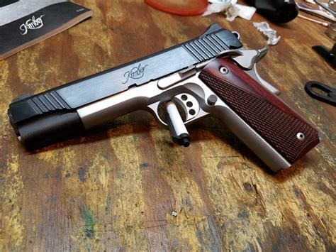 A visual inspection of this one shows good quality in finish and fit which may be an indication on how it will perform out in the field. Blued and stainless mix in a 1911 - Shooters Forum