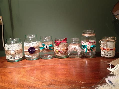 Hand decorated jam jar centrepieces. Wedding or hen do. Lace, ribbon