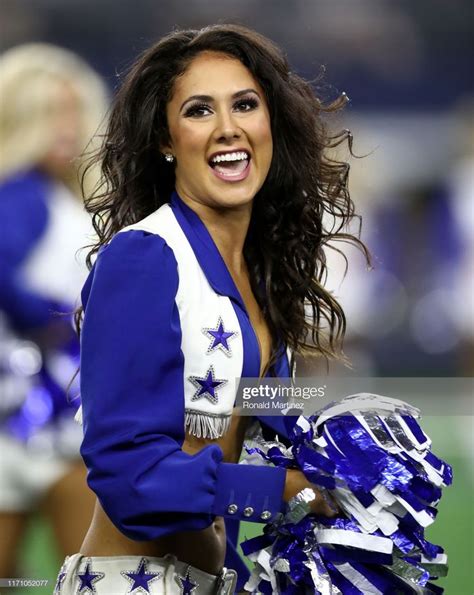 A Dallas Cowboys Cheerleader Performs During A Nfl Preseason Game At