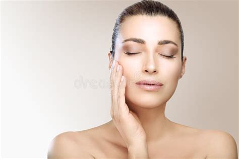 spa beauty and skin care concept beautiful woman face with flawless skin touching her fresh