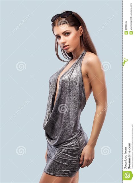 Blonde Woman Wearing Swimwear Posing On Color Background