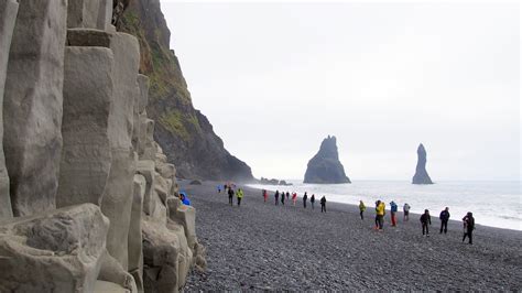 Walking Reynisfjara Black Sand Beach In Iceland The World Is A Book