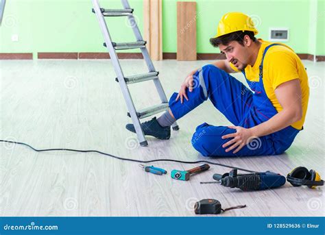 The Injured Worker At The Work Site Stock Photo Image Of Handyman