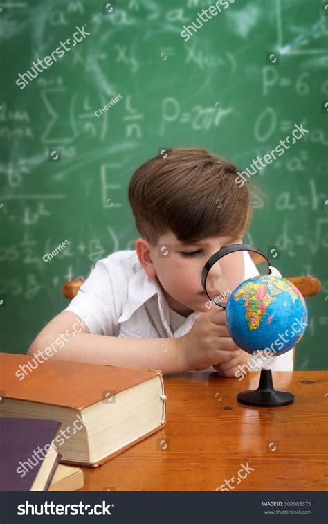 Funny Schoolboy Holding Book Overhead Education Stock Photo Edit Now