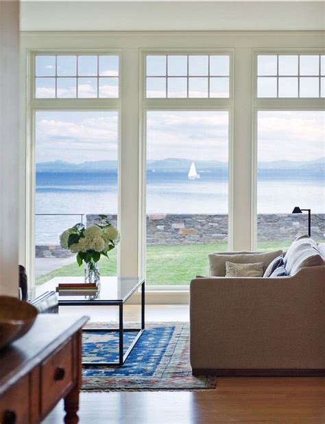 Bedroom with floor to ceiling windows and white curtains. Nice 45 Perfect Coastal Living Room Ideas. More at https ...