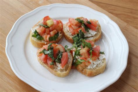 In a medium mixing bowl, add chopped tomatoes, finely minced garlic, olive oil, balsamic vinegar, and basil together. Goat Cheese Bruschetta Recipe | Monica Dutia: The Blog