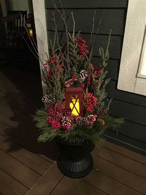 Create an easy holiday planter or flower pot for a pretty front porch christmas decoration. Decorative Christmas planter with lantern. | Front porch ...