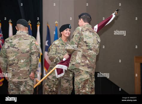 Csm Janell Ray Hands The Battalion Flag To Col Kevin Bass During The