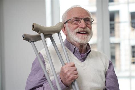 Using Crutches Fascilitates Recovery After Leg Injury Stock Image