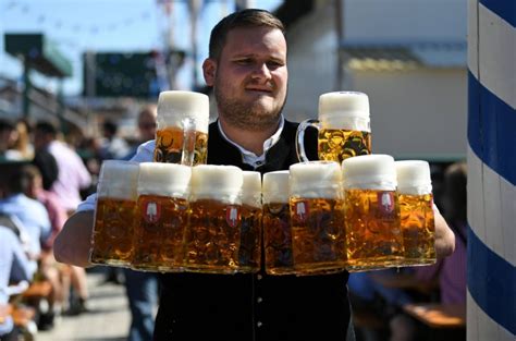 beer starts flowing as thousands storm gates for oktoberfest metro news