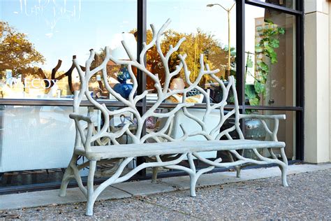 The bench is extremely solid. Branch Faux Bois Concrete Bench - Mecox Gardens
