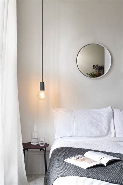 This black pendant set against the white walls is the perfect way to draw attention to the light s cylindrical shape. Lightly Dropping In | Bedside pendant lights, Pendant ...