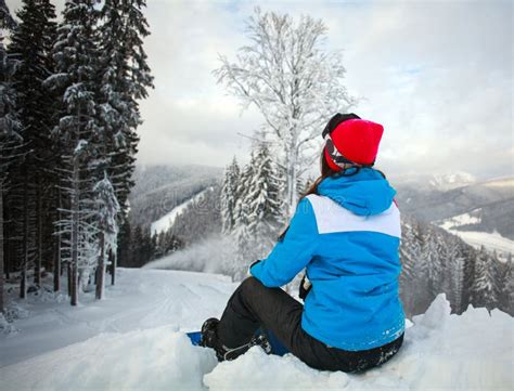 Young Pensive Woman In Winter In Snowy Forest On Top Of Mountain Stock