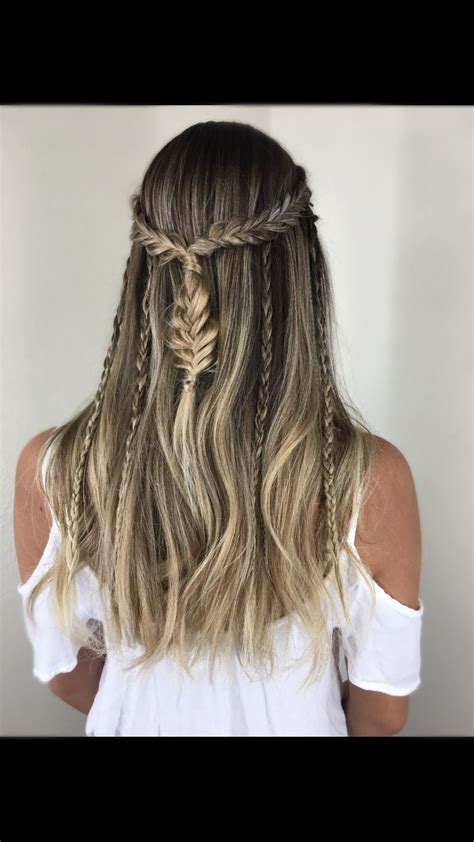 Messy buns are always a great style choice and this one has a fishtail braid woven in. Boho inspired | Braided hairstyles, Long hair styles, Hair ...