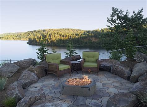 A fire pit creates a natural focal point and gathering place for backyard evenings. Fire Pit Natural Stone | Fire pit natural stone, Natural ...