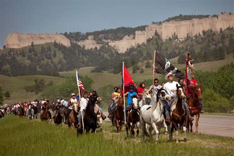 The Red Lakota First Nation Flag Leads The Annual Crazy Horse Ride From