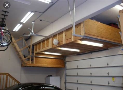See more ideas about garage storage, overhead garage storage, garage organization. Storage loft above garage door mechanism. | Garage ceiling ...