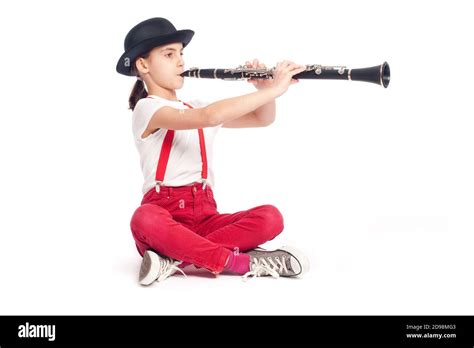 Little Girl Playing Clarinet On A White Background Stock Photo Alamy