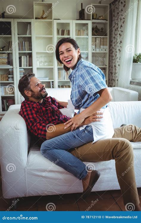 Happy Woman Sitting On Mans Lap In Living Room Stock Photo Image Of Household Abode